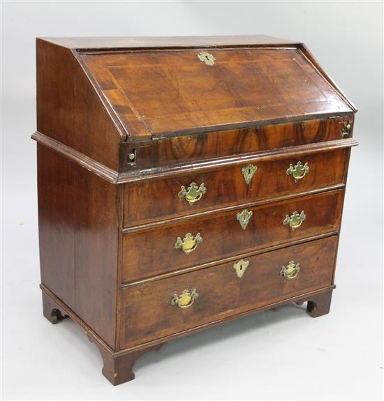 An early 18th century walnut and featherbanded bureau, W.3ft